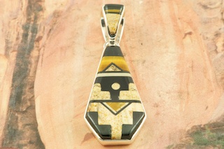Stunning Pendant featuring Genuine Picture Jasper and Black Jade inlaid in Sterling Silver. Reversible pendant features a beautiful contemporary design. Free 18" Sterling Silver Chain with Purchase of Pendant. Designed by Navajo Artist Calvin Begay. Signed by the artist.